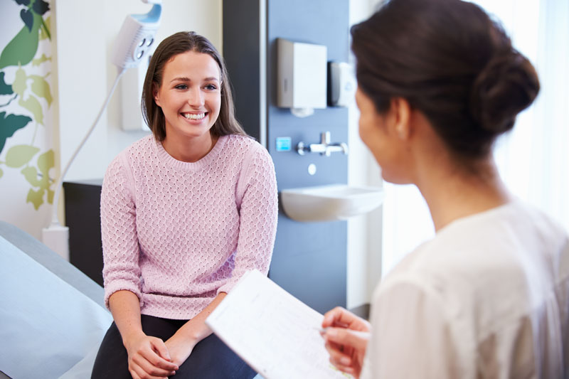 Women smiling at doctor