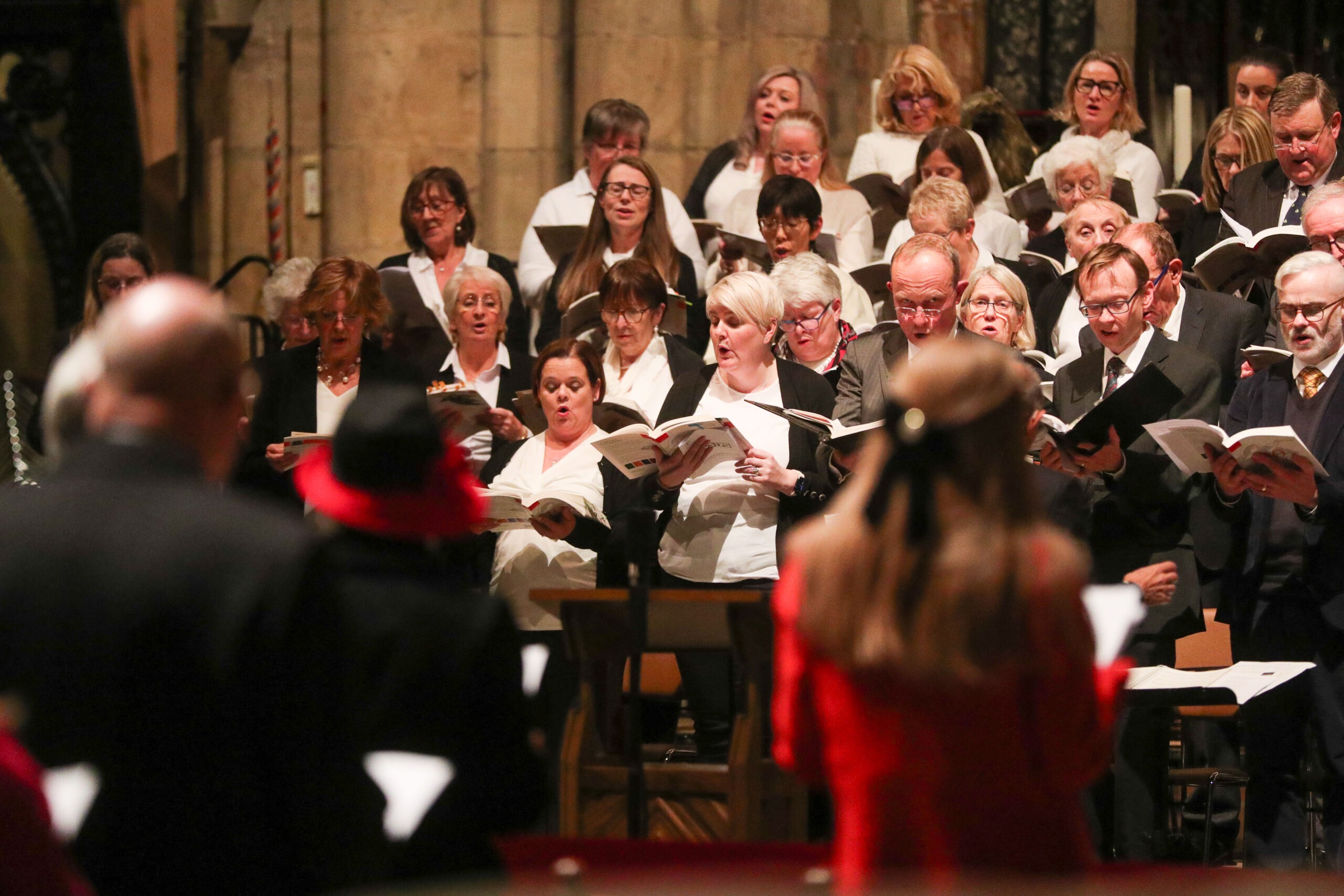 Members of the NHS choir singing in Durham Cathedral