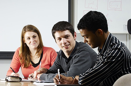 Three people in meeting