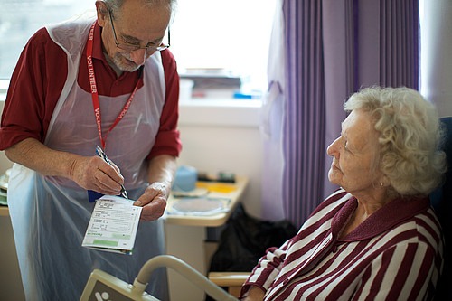 Elderly patient and nurse in care home