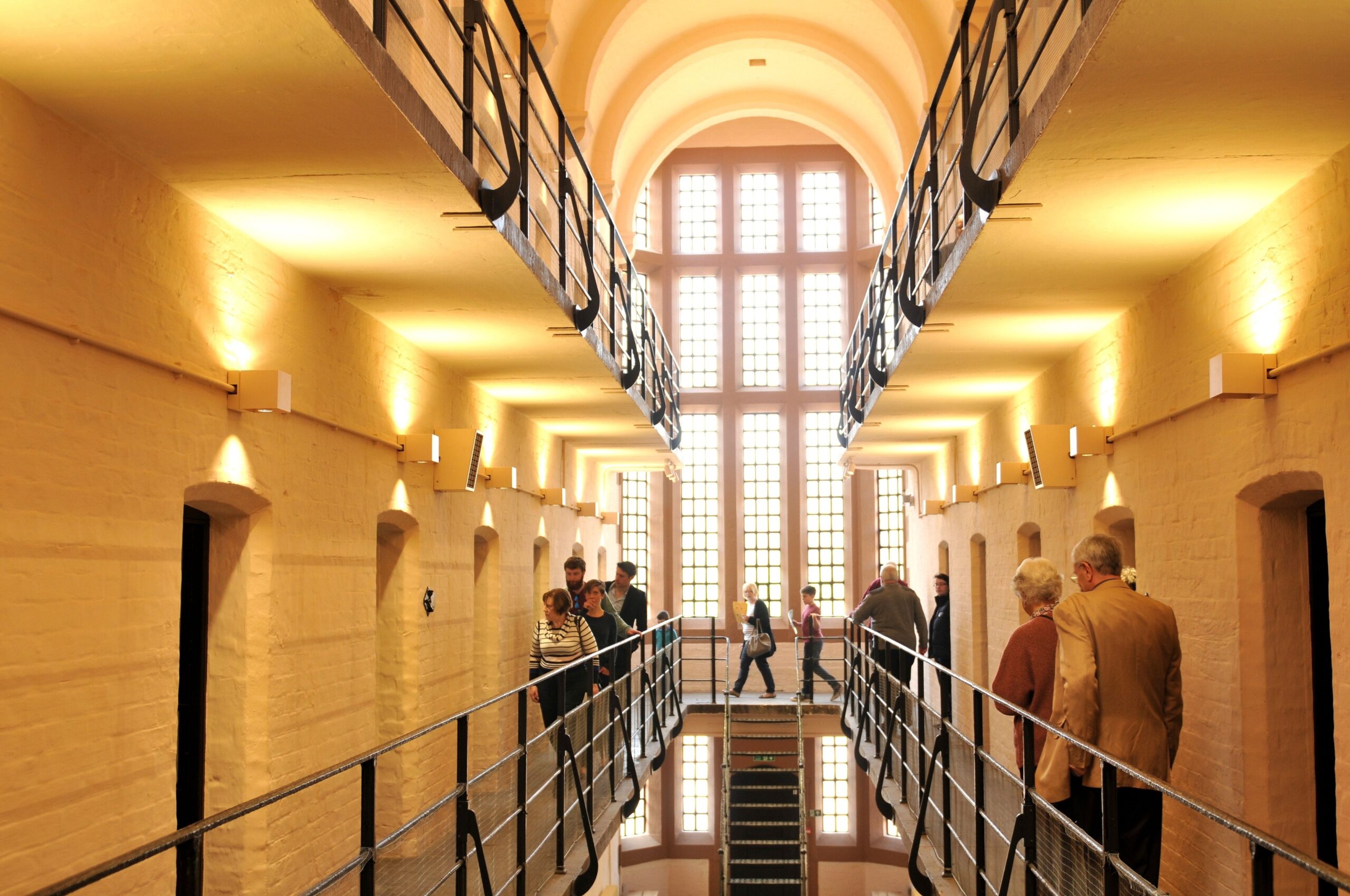 People walking around on a prison wing