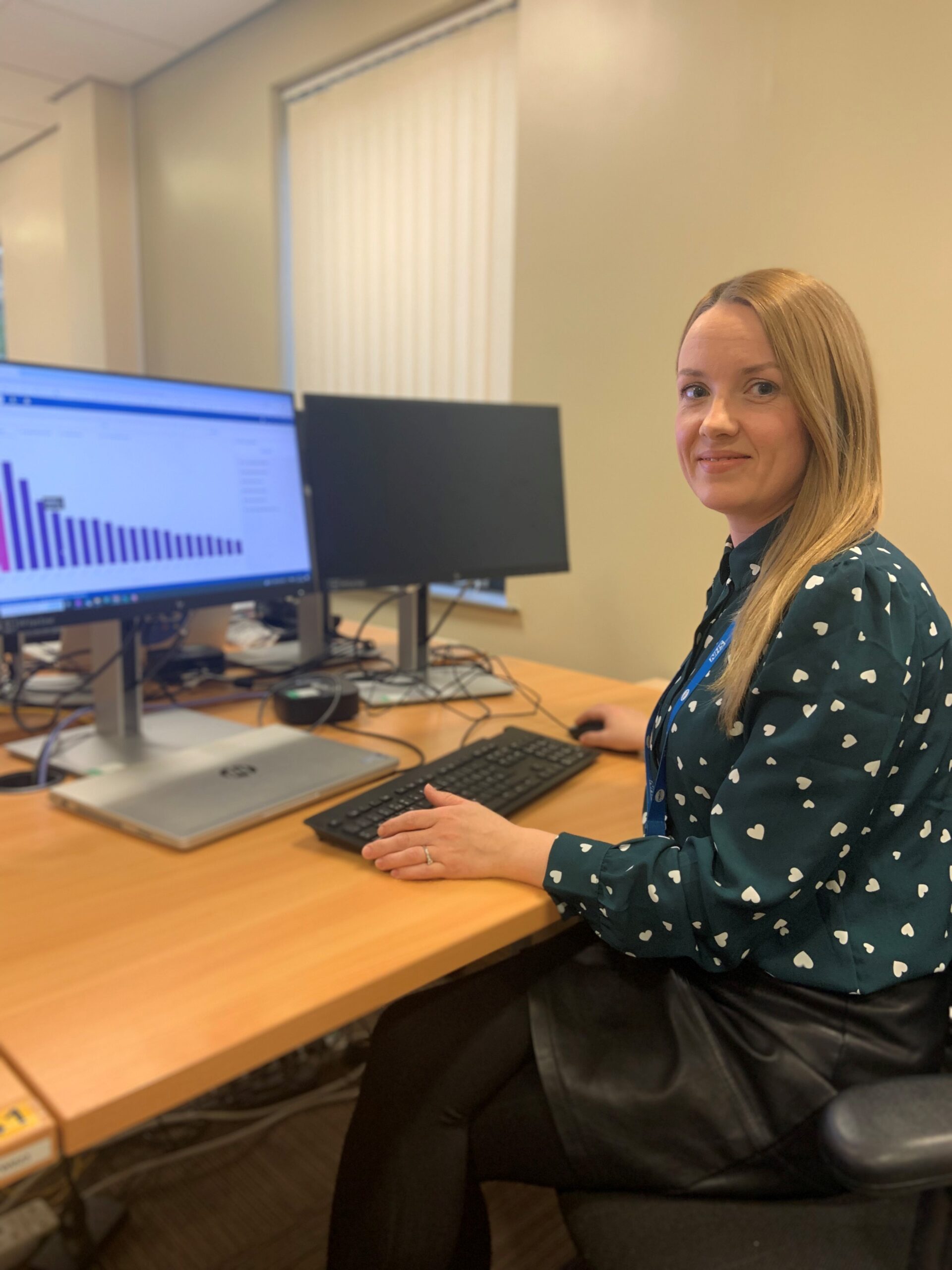 Victoria Pescod, Information Solutions Senior Support Officer for RAIDR sat at her desk with her laptop in front of her