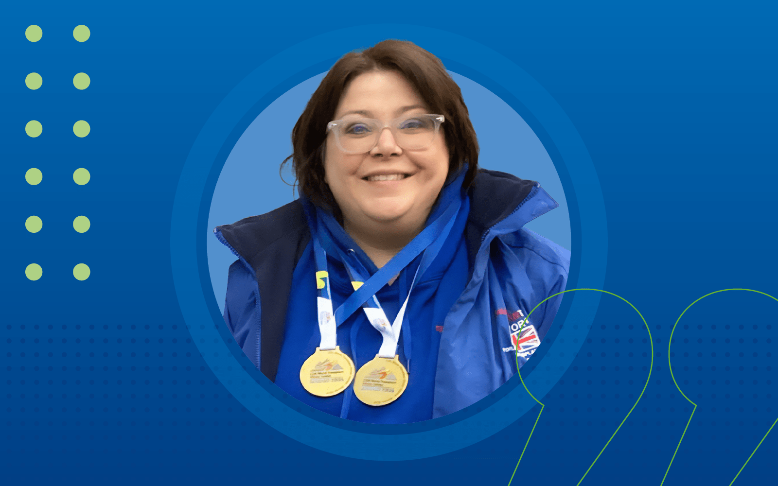 Head and shoulder shot of Linda Owen with her two gold medals around her neck