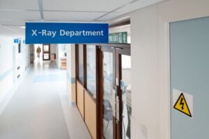 X Ray department A photo of a hospital corridor with a sign showing the Z-Ray department