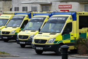 Parked ambulances A fleet of ambulances parked outside of an A&E department