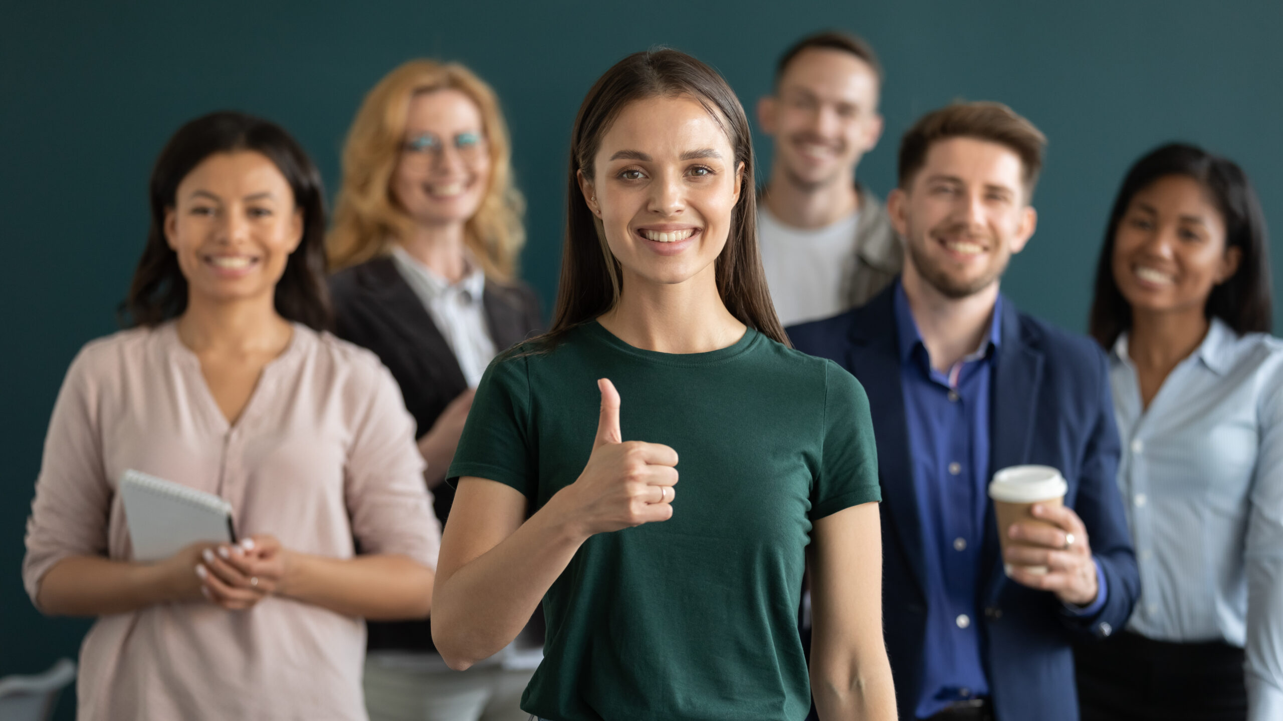 shutterstock_2237569391 Six people standing in work group