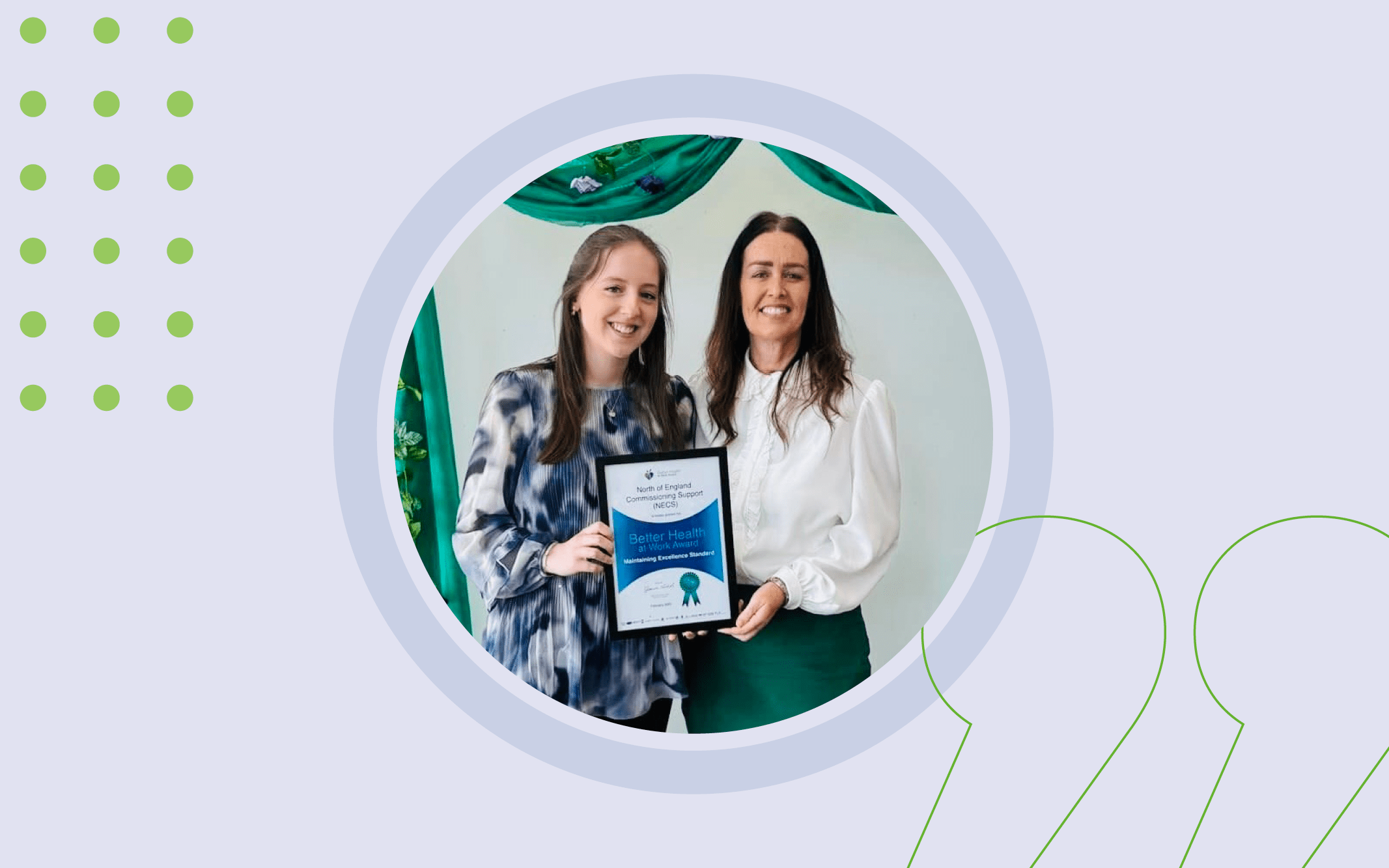 Laura Edmondston and Kerry Jones stood together holding a framed certificate