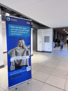 NHS App pull up banner being displayed in a student area at Durham Uni