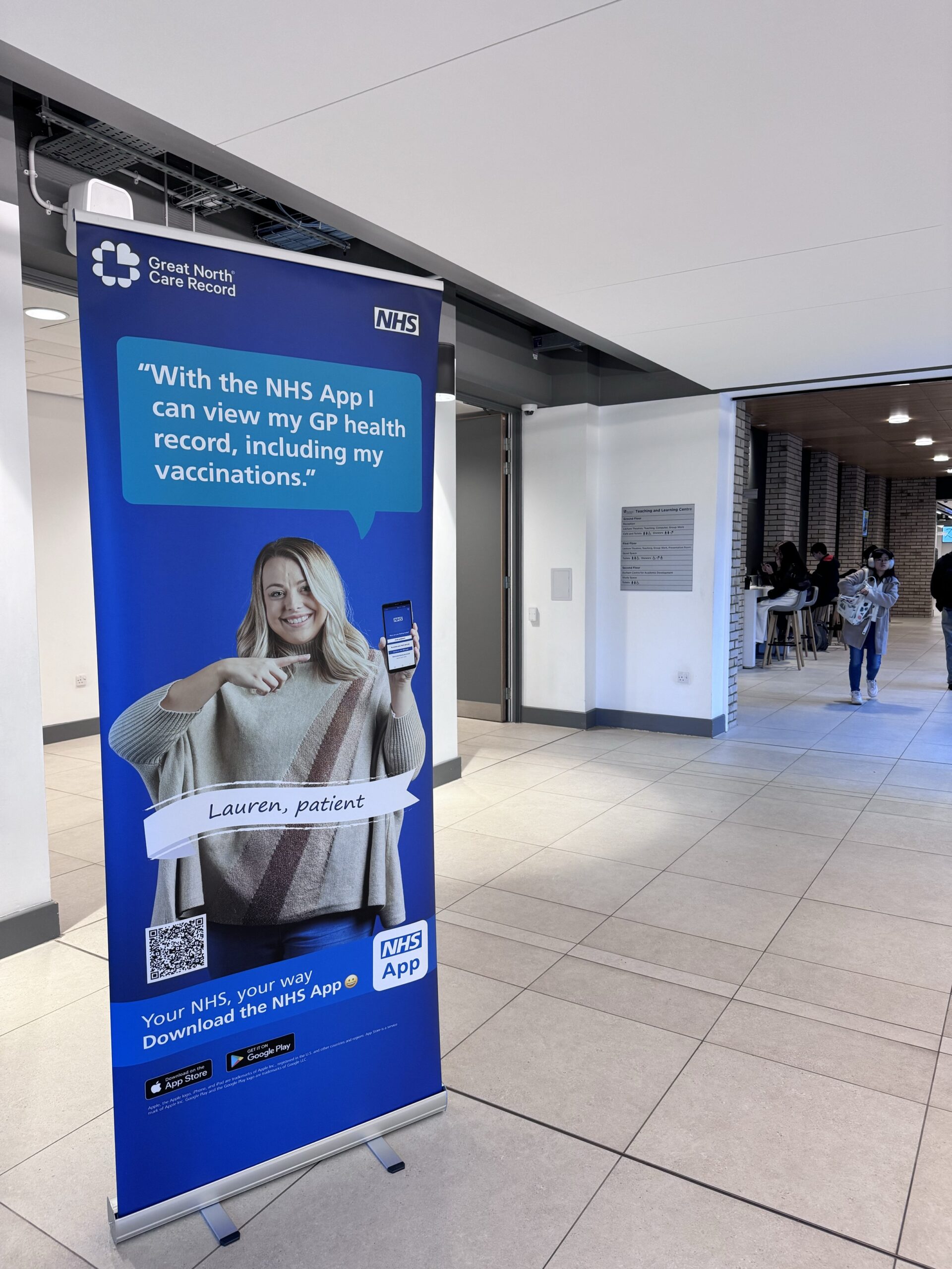 NHS App pull up banner being displayed in a student area at Durham Uni