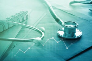 Image of stethoscope, charts and papers