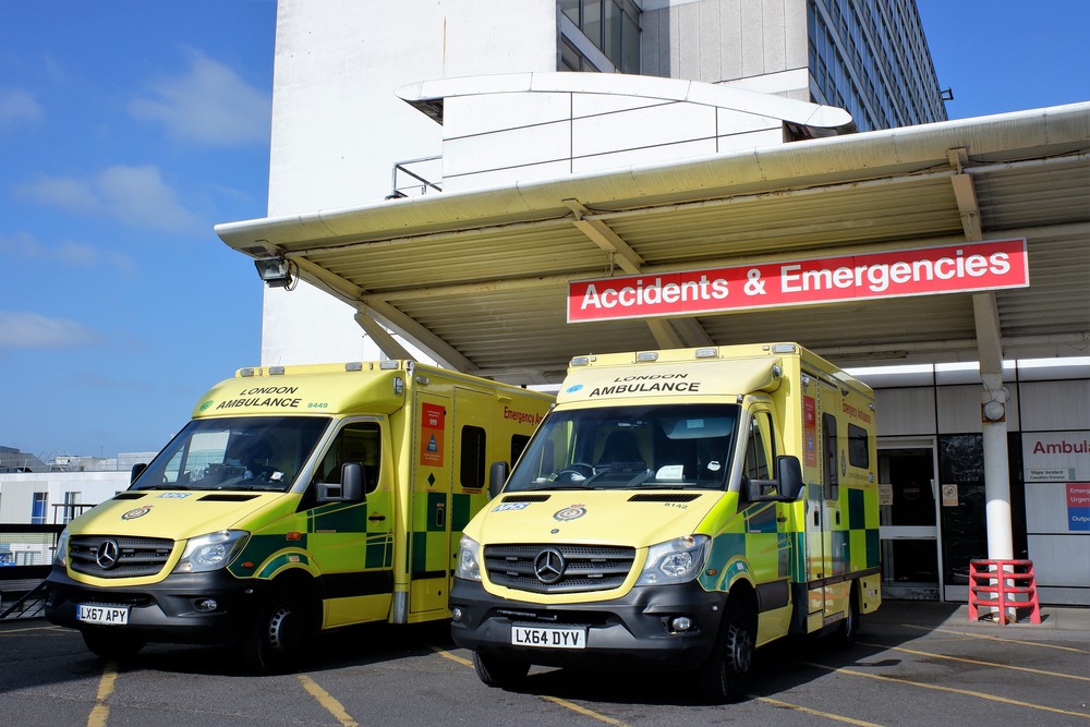 Photo of two ambulances outside hospital emergency department