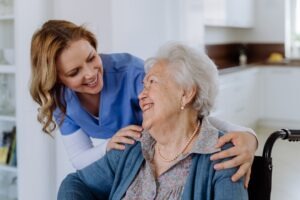 Photo of nurse and elderly patient in care home