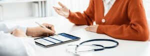 Doctor and patient viewing medical record