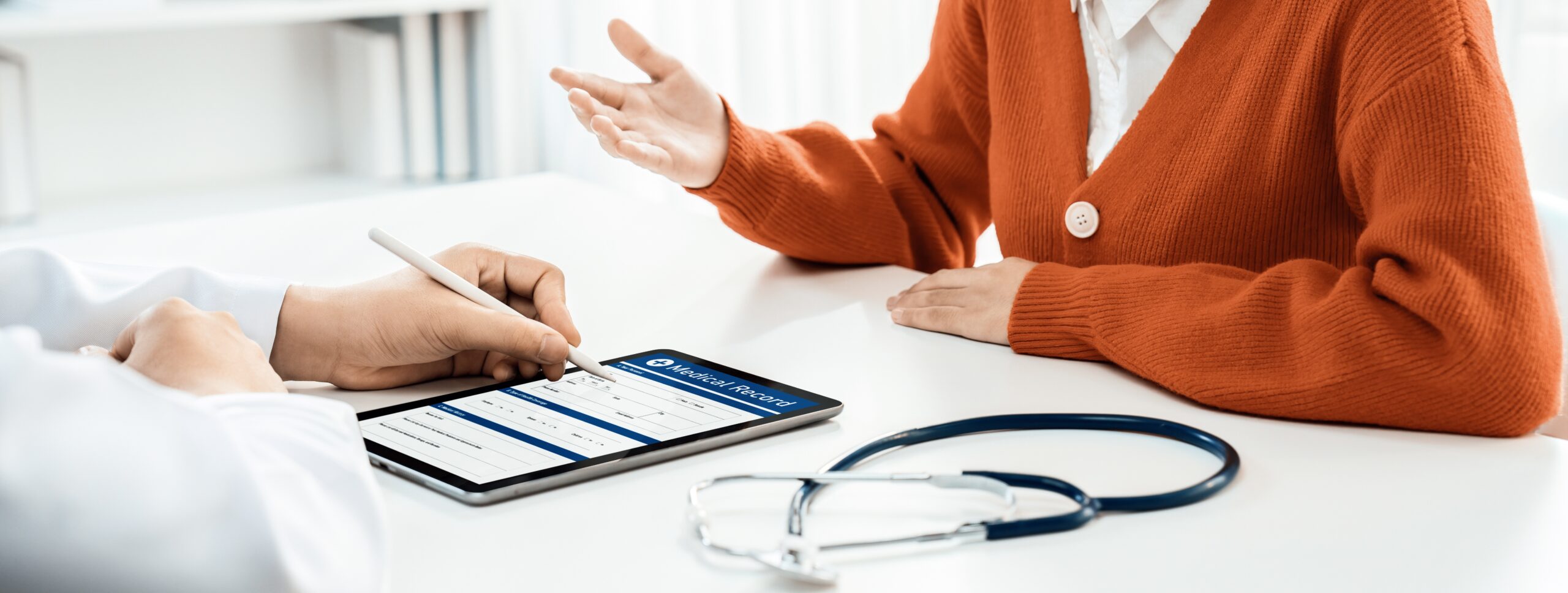 Doctor and patient viewing medical record